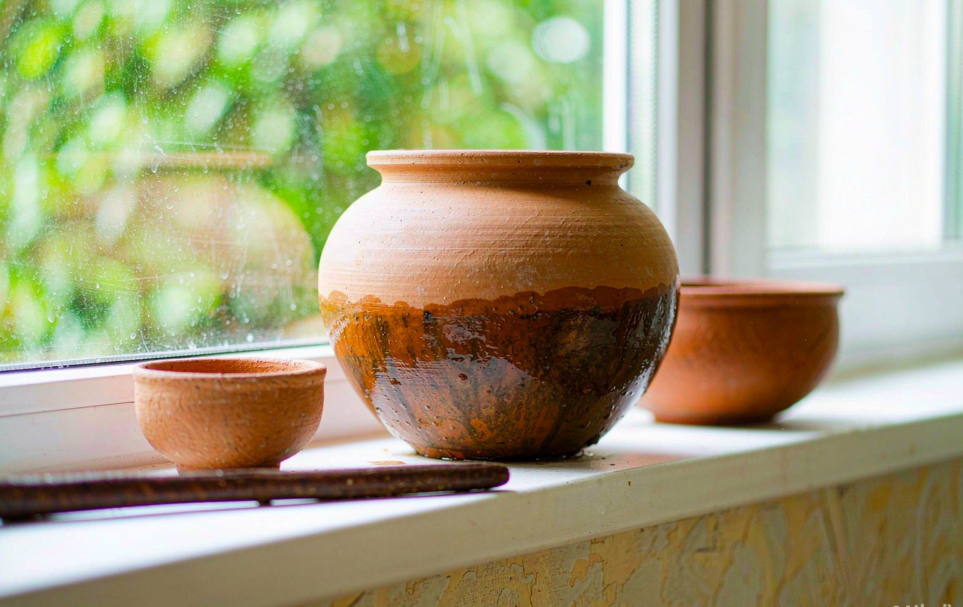 Terracotta pots on a bright windowsill